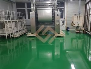 High gloss green industrial epoxy flooring by Chemflex Chemicals in a large scale biscuit manufacturing factory, Sri Lanka.